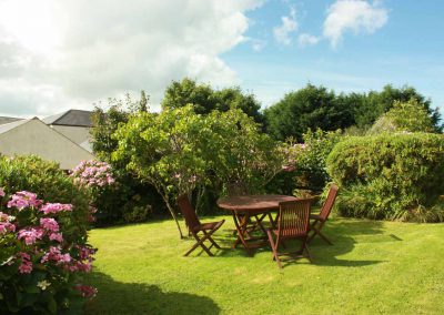 Blackberry's enclosed garden is a sunny spot to enjoy a BBQ surrounded by colourful shrubs
